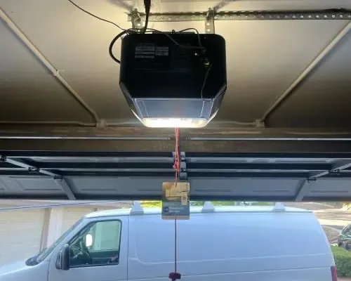 Garage door opener mounted on the ceiling